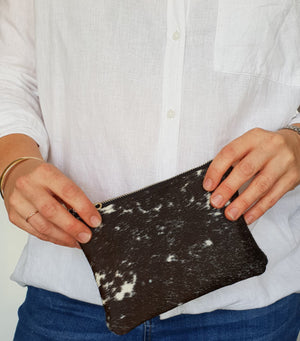 Black and white cowhide clutch