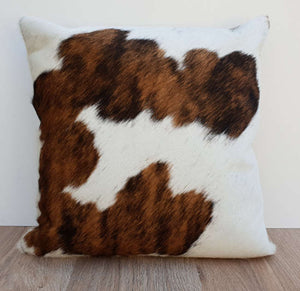 Tan Brown and white cowhide cushion 