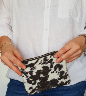 Black and white cowhide clutch