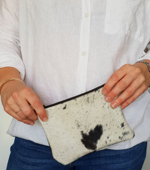 Black and white cowhide clutch