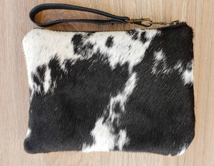 Black and white cowhide mini clutch