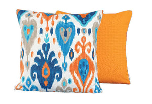 Blue ikat with orange cushion covers