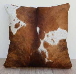 Tan Brown and white cowhide cushion 