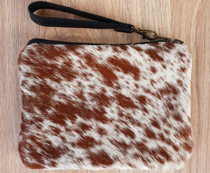 Brown and white cowhide mini clutch