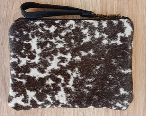 Black and white cowhide mini clutch